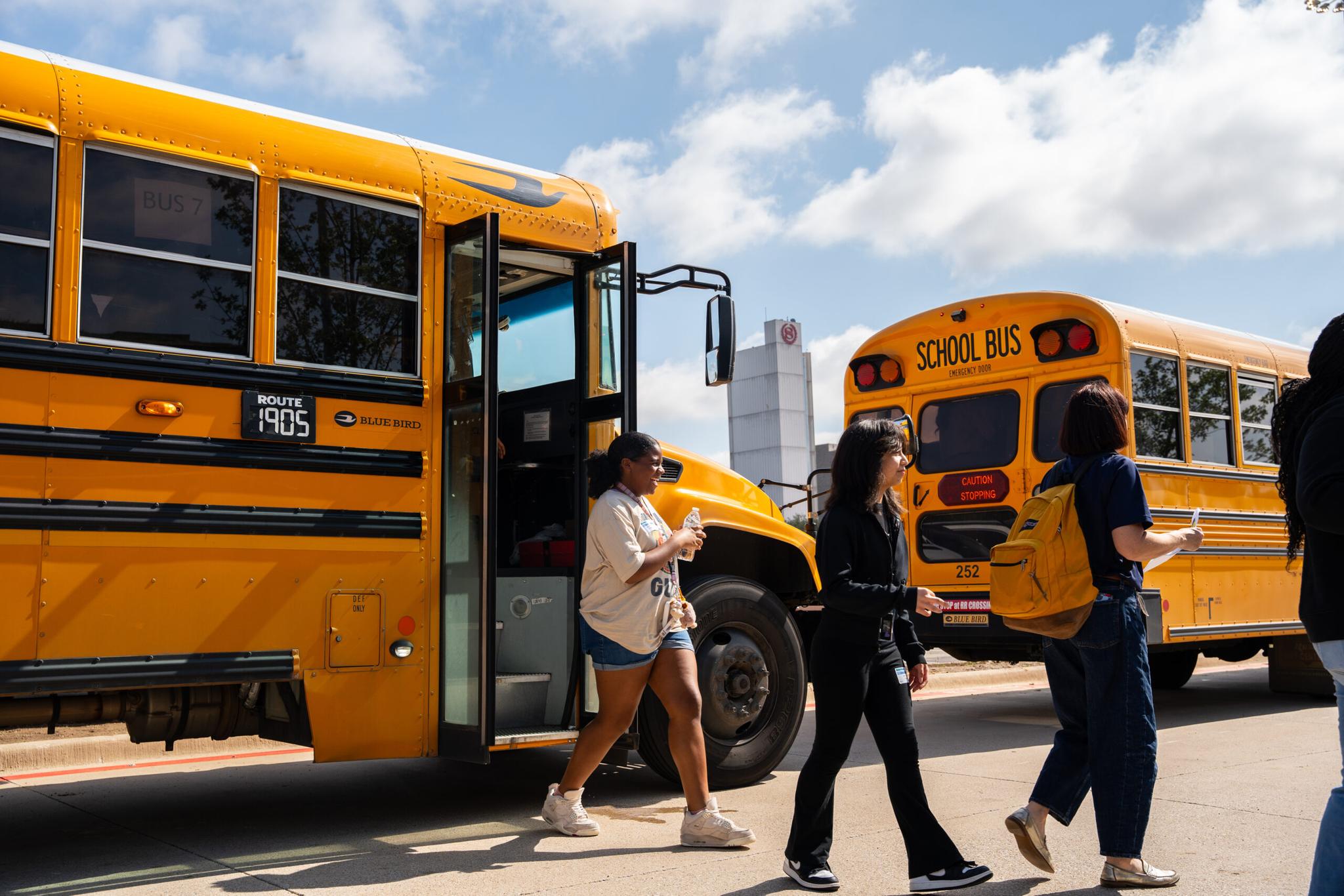 Students getting off a bus